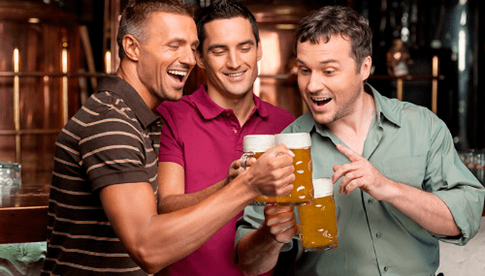 a group of friends with a beer